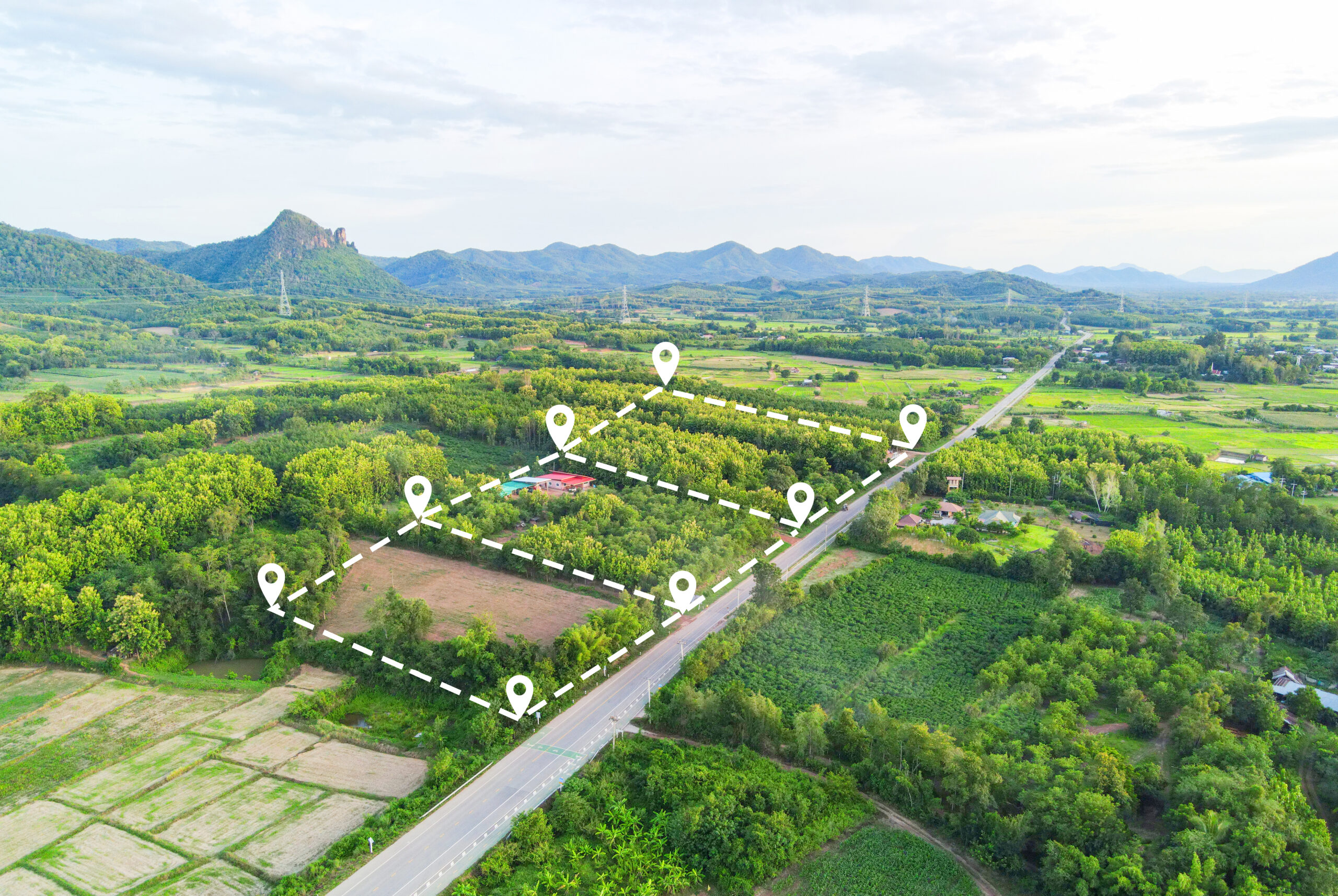 Land plot for building house aerial view, land field with pins,