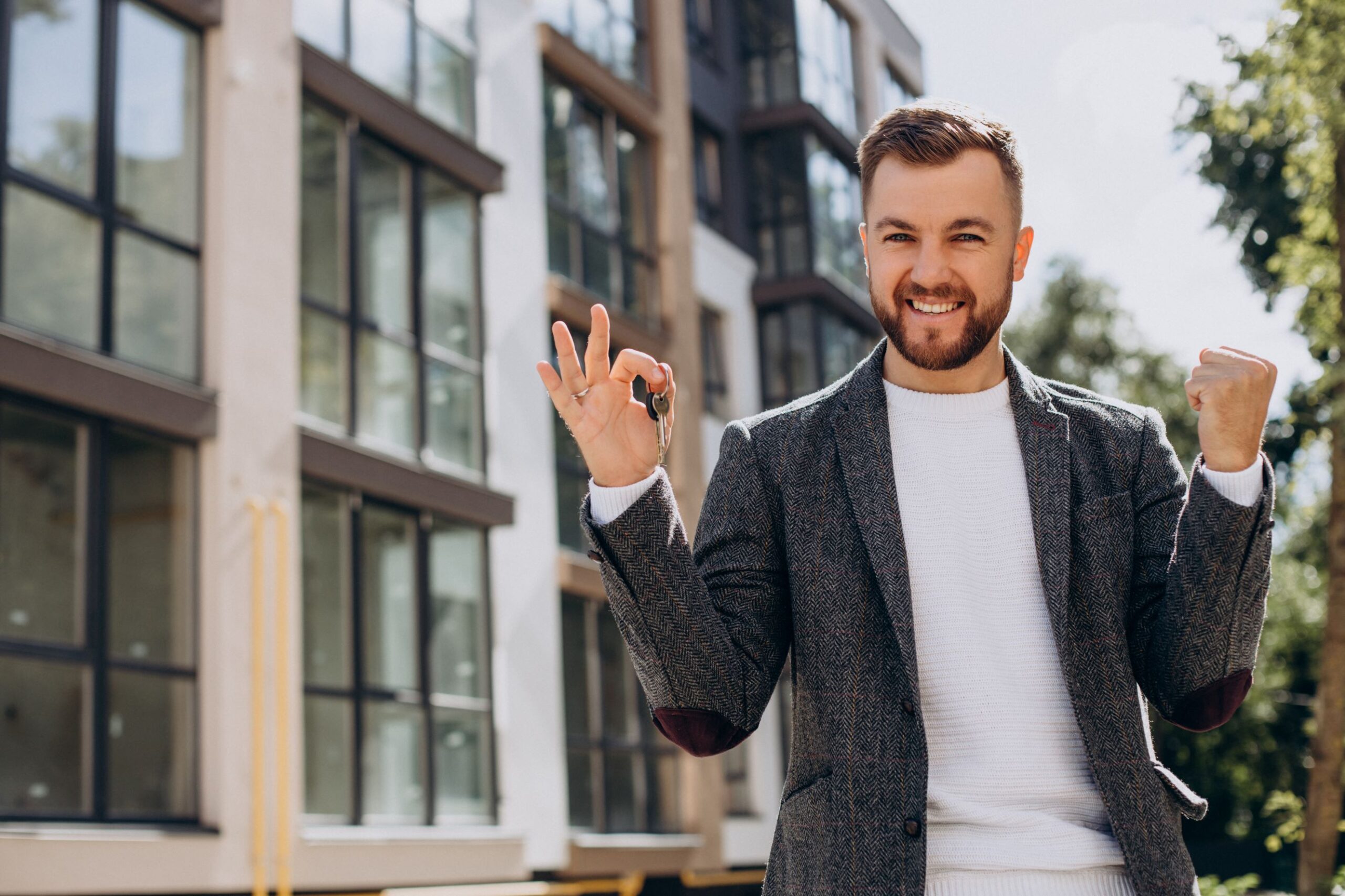 young-man-with-keys-just-bought-new-appartment (1)