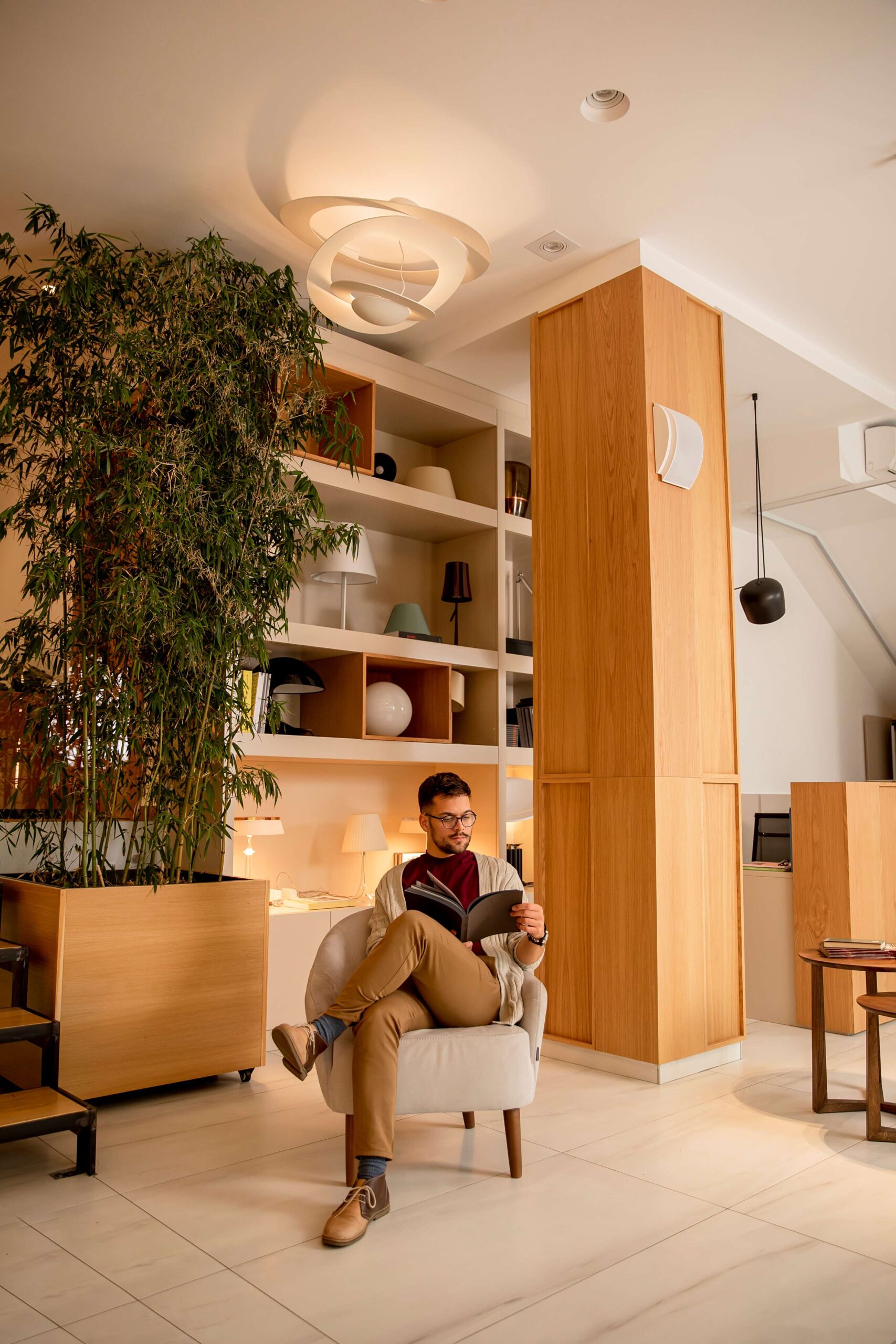 handsome-young-man-casual-clothes-with-eyeglasses-reading-book-home