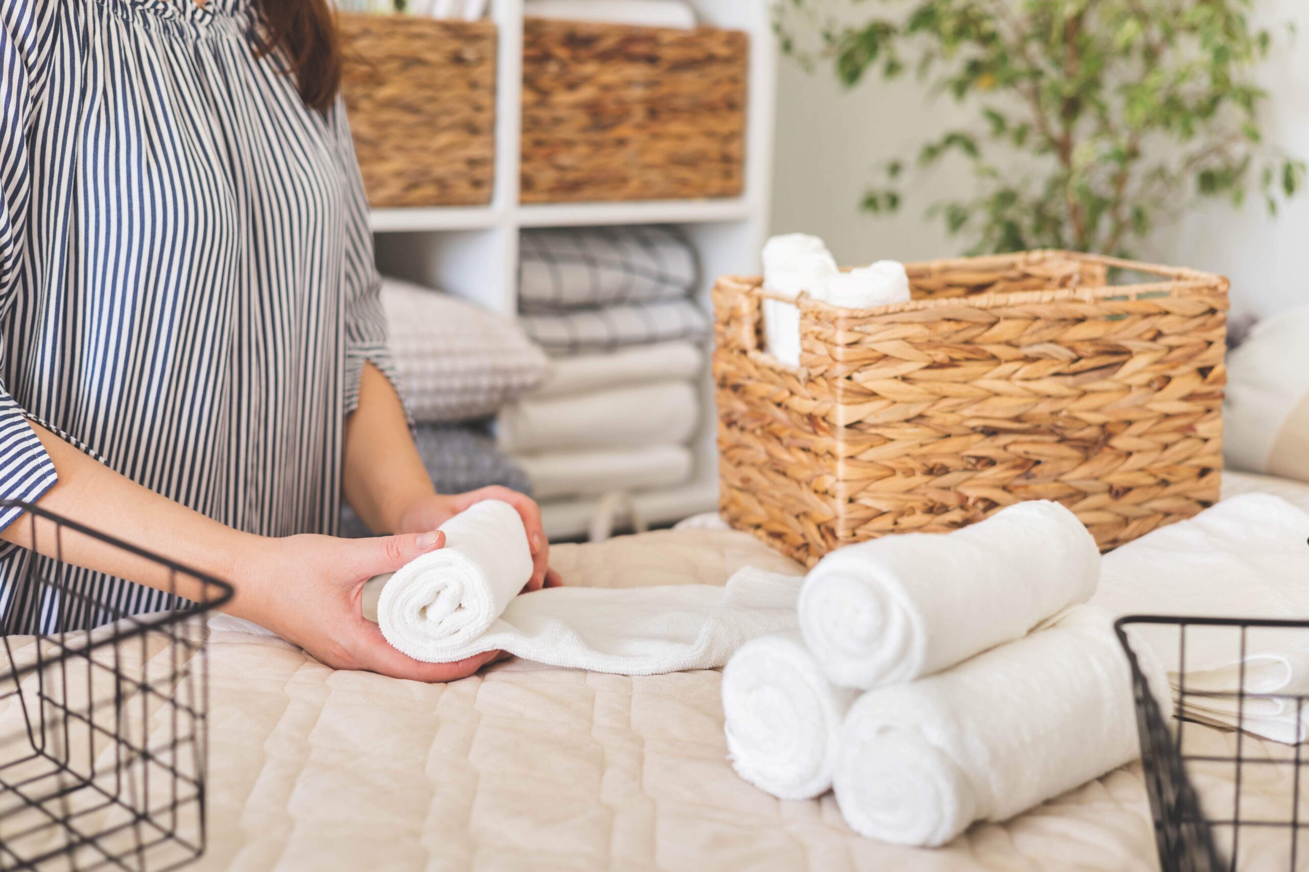 female-hands-neatly-folded-white-clean-towels-case-box-use-japanese-organizing-method-woman-housewife-arms-comfortable-storage-linens-cupboard-enjoying-bedroom-tidying-up-closeup