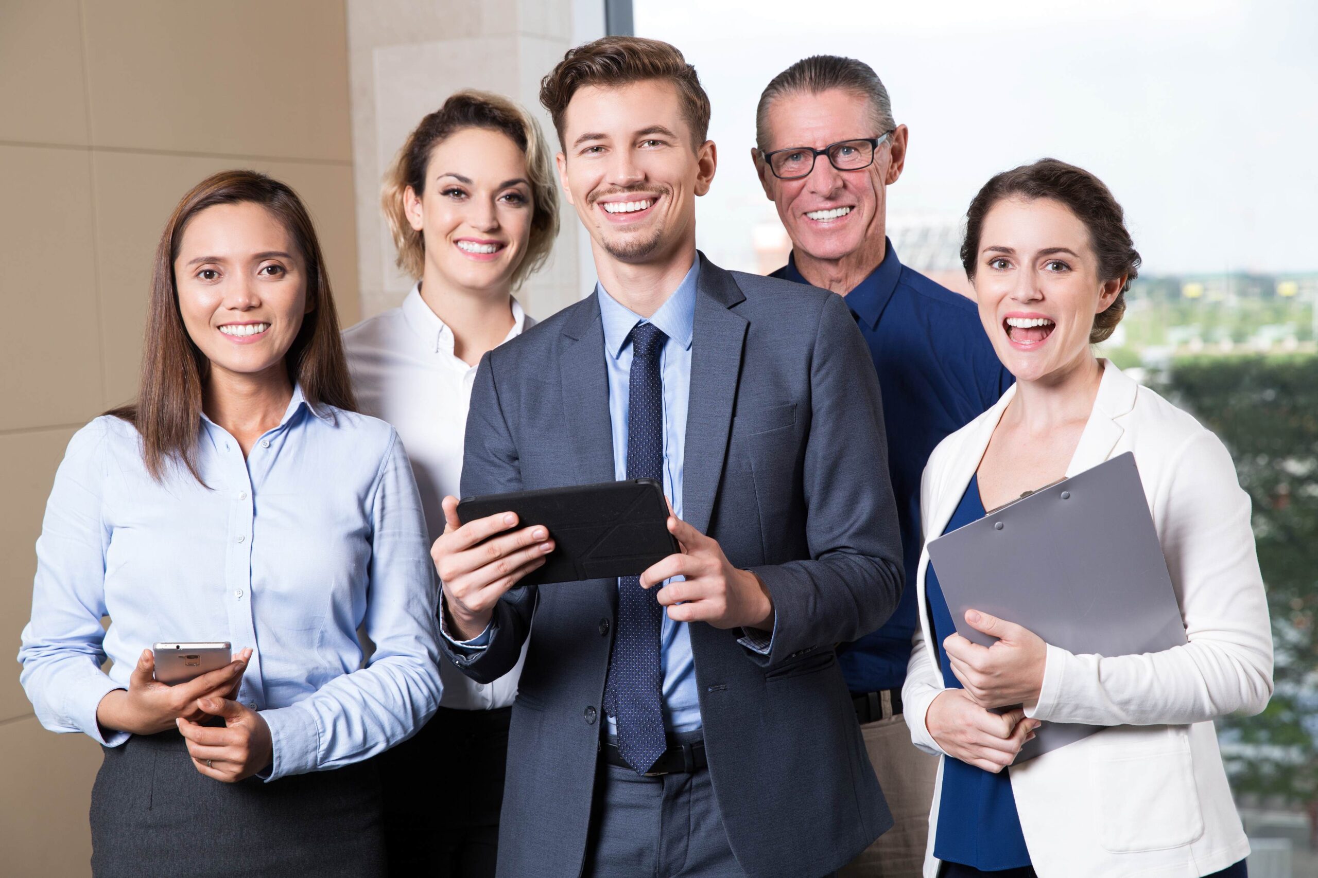 smiling-business-team-standing-conference-room